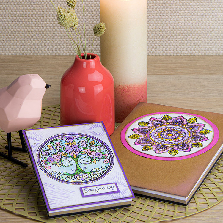 Image of a two notebooks with a mandala stamp