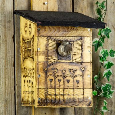 image of birdhouse decorated with wood burner